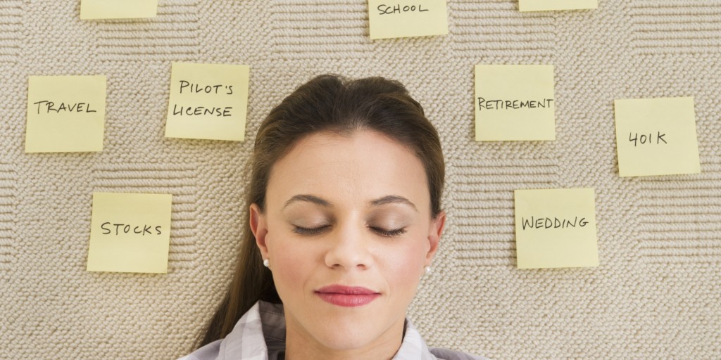 USA, New Jersey, Jersey City, Woman lying on carpet with adhesive notes around head